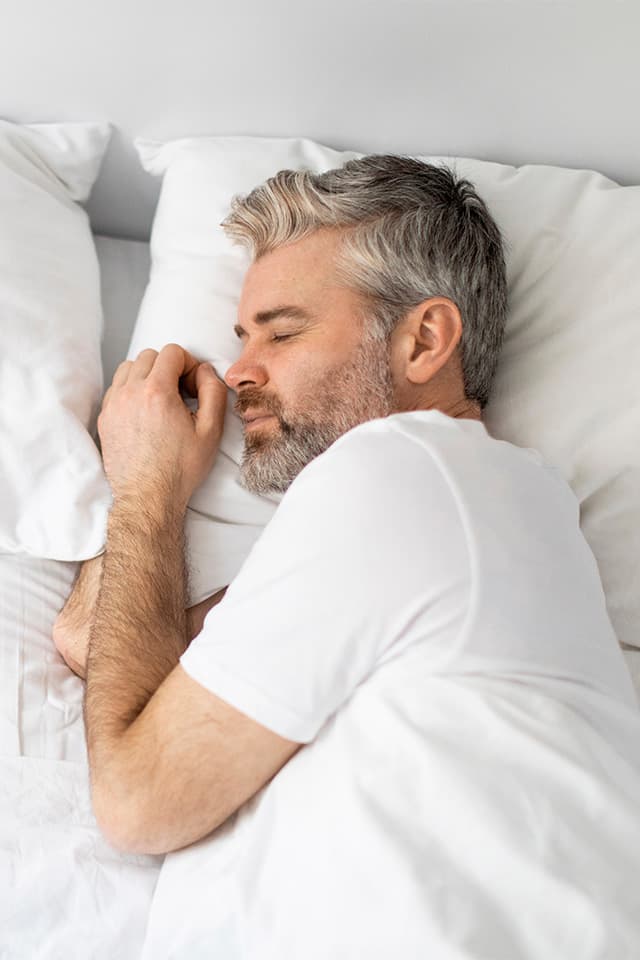 A man peacefully sleeping.